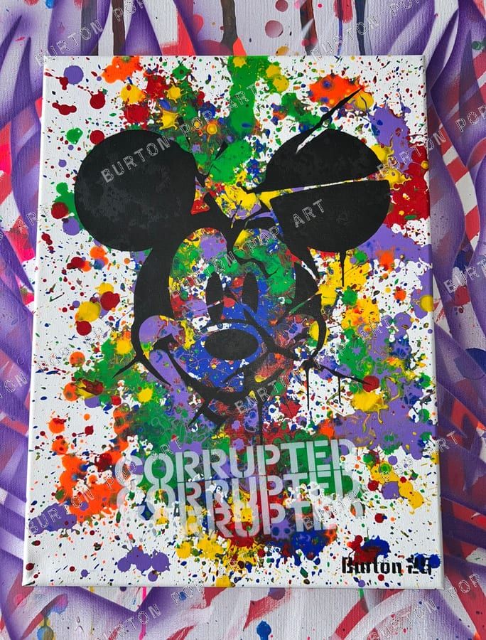 Mickey Mouse stencil in black over rainbow paint splatter on white, with faint Corrupted lettering.