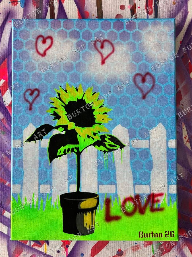 Stencil sunflower being painted by a spray-can roller, blue honeycomb background with red hearts and the word Love.